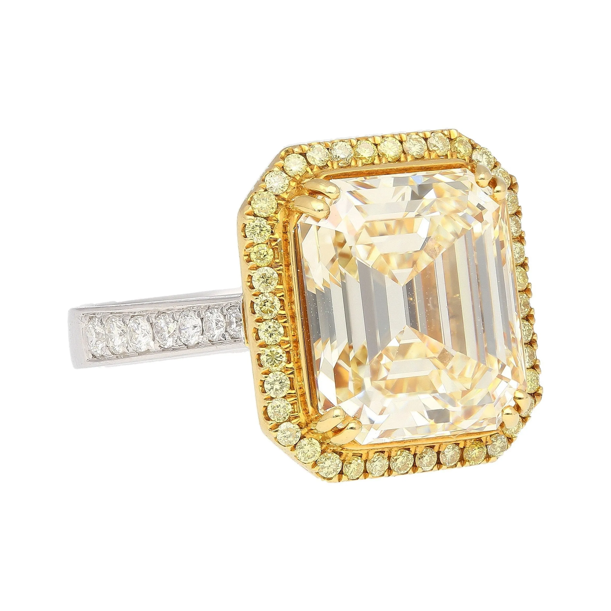 Emerald Cut Natural 7.25 Carat Fancy Light Yellow Diamond with Round Diamond Halo Ring