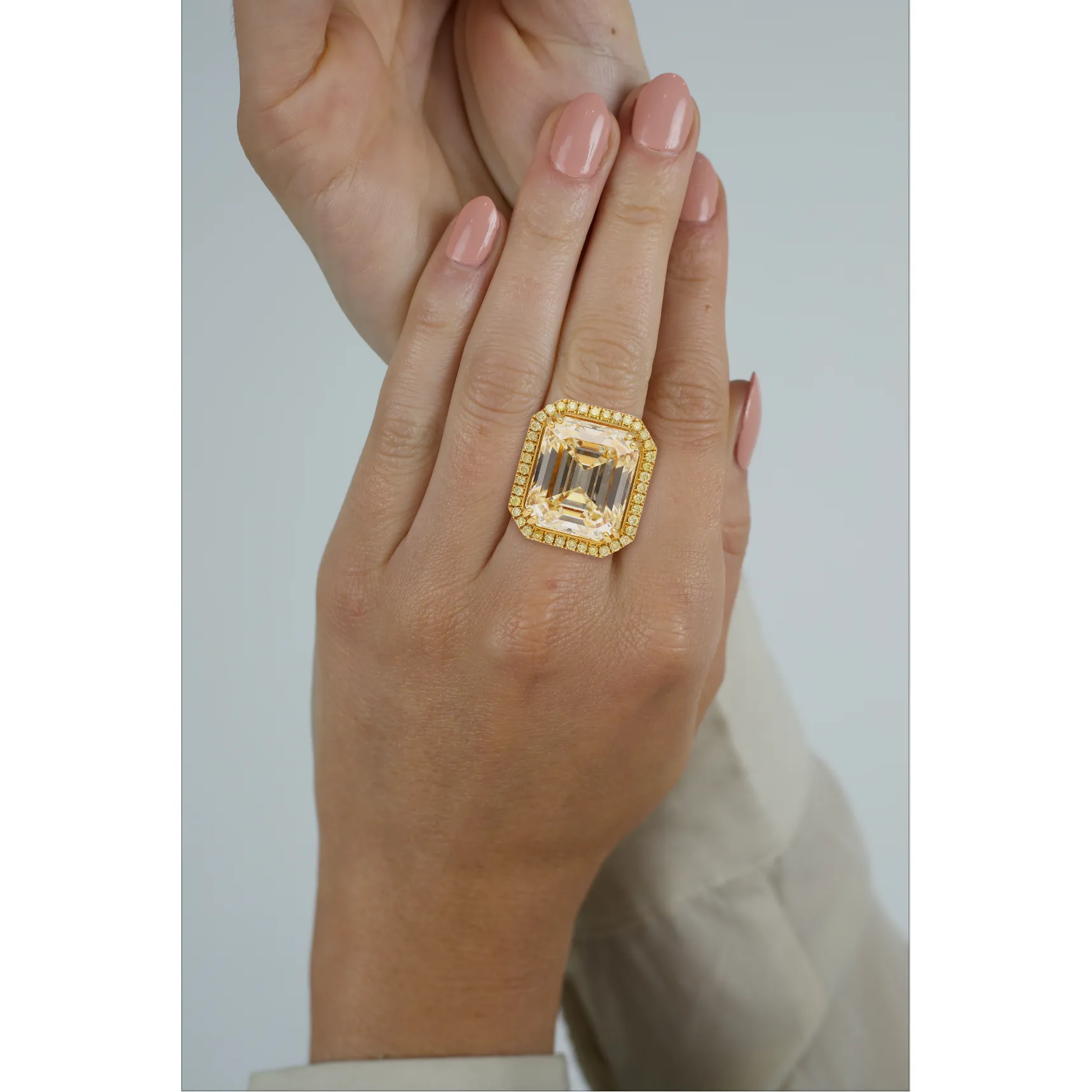 Emerald Cut Natural 7.25 Carat Fancy Light Yellow Diamond with Round Diamond Halo Ring